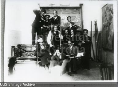 Aula amb alumnes de l'Escola Normal fent teatre. [Photograph]